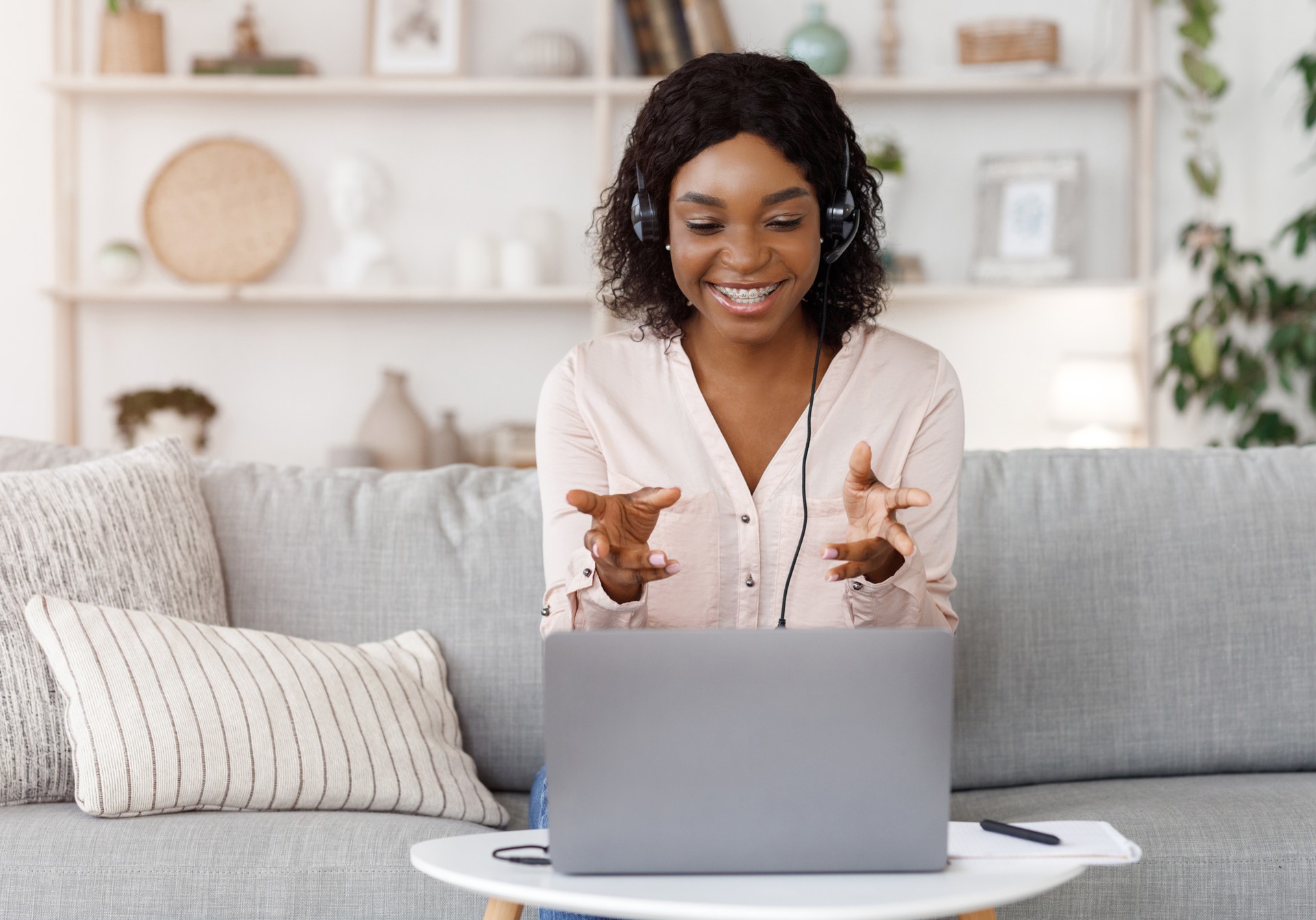 Online Tutoring Concept. Smiling black female tutor having video call with student